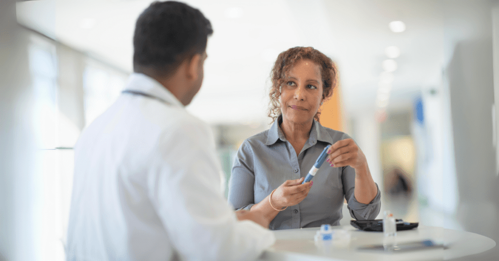 Clinical researcher talking to Hispanic participant in clinical trial